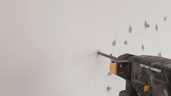 Drilling into wall Stock Footage
