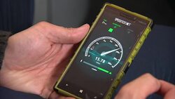 Broadband Speed Being Checked on Mobile Phone News Clip