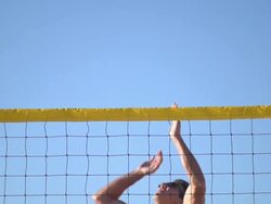 A man spiking a beach volleyball. - Slow Motion - filmed at 240 fps Stock Footage