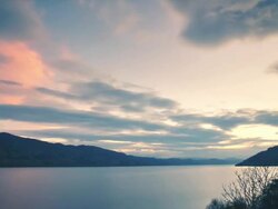 WS T/L View of Sunset over Loch Ness, clouds / Loch Ness, Scotland, United Kingdom Stock Footage