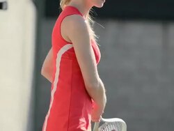 CU ECU of a female tennis player as she hits the tennis ball backhand. Stock Footage