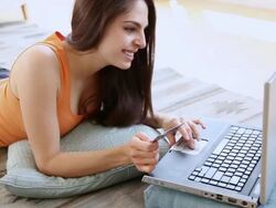 MS ZI ZO Woman writing credit card number on laptop / Jersey City, New Jersey, United States Stock Footage
