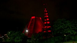 Rio landmarks lit in red to mark world AIDS day; stalls in Lima hand out condoms News Clip