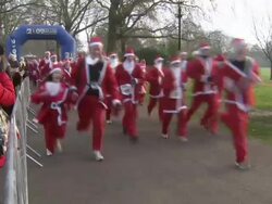 Thousands of Santas Run Through Battersea Park News Clip