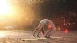 Young Woman Doing Yoga Meditation Exercises at Sunset Stock Footage