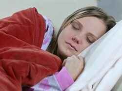 HD DOLLY: Woman With Cold Sleeping On Sofa Stock Footage