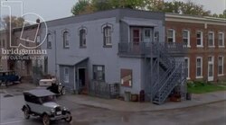 Car driving by a workers' mill, 1930s - reenactment, clip 4 Stock Footage