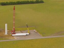WS AERIAL DS ZI View of workers working on windmill / Macarthur, Victoria, Australia Stock Footage