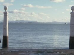WS View of Column of Ancient landing stage and one man standing in stage  / Lisbon, Lisbon, Portugal Stock Footage