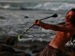 MS TS Rasta man spinning poi balls on beach with ocean / Montezuma, Punteranes, Costa Rica Stock Footage