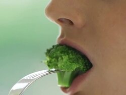 Eating broccoli  HE FO Stock Footage