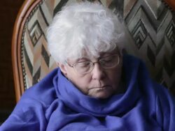 Elderly woman looking at electronic device Stock Footage
