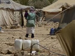 Syrian refugee mother in Jordanian camp Stock Footage