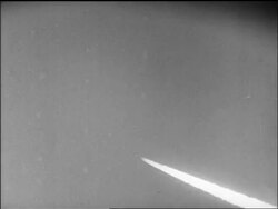 B/W 1947 wide shot smoke coming from Yeager's Bell X-1 airplane as it breaks sound barrier / CA / newsreel Stock Footage