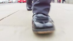 Close-up of a Businessman`s feet as he is walking Stock Footage