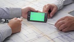 Architect's Woman and a Man Touching Touch Screen, Gesturing and Shaking Hands Over The Blueprint Set on The Table Stock Footage