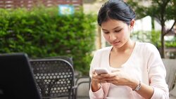 Young woman using mobile phone Stock Footage
