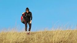 Young woman resting after a long run on the hill. Stock Footage