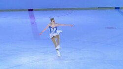 SLO MO TS Female figure skater in sit spin variation Stock Footage