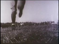Football player Jackie Robinson plays for the UCLA team. News Clip
