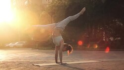 Young Woman Doing Yoga Meditation Exercises at Sunset Stock Footage