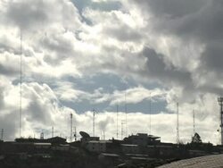 "Hilltop residences, huge sattelite dish, multiple communication towers, cloudy sky, Chachapoyas, Peru [PerÃƒÂº]" Stock Footage