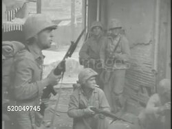 1950: KOREAN WAR: BATTLE OF SEOUL: * VS United States Marines firing on & advancing into Seoul, tanks rolling into war torn city, soldiers firing from defensive positions next to buildings, moving through streets, carrying wounded. Korea Instructional Video