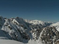 Beautiful snowy mountain panorama panning shot Stock Footage
