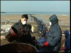 WRAP Clean-up continues after tanker collision, min declares disaster ADDS reax News Clip