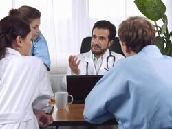 HD DOLLY: Senior Doctor Talking With Specialists Stock Footage