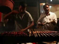MS Chefs making kebabs at food stall / Delhi, Delhi, India Stock Footage