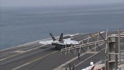 US Fighter jets landing on USS Carl Vinson News Clip