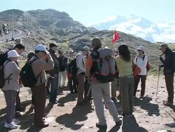 MS Two guide giving guidence to tourist hiker at rotenboden / Zermatt, Valais, Switzerland Stock Footage