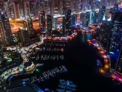 High view on Dubai Marina and Sheikh Zayed Road at night zoom out Stock Footage