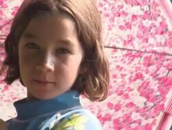 young girl with umbrella Stock Footage