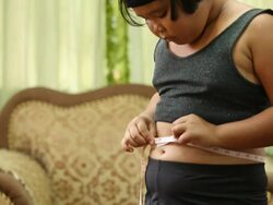 girl with measuring tape Stock Footage