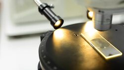 panning: Microscopy slide under orange light Stock Footage