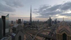 The Burj Khalifa Dubai, elevated view across Sheikh Zayed Road and Financial Centre Road Interchange, Downtown Dubai, Dubai, UAE Stock Footage