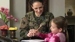 Military Mom Helps Daughter with Homework Stock Footage