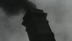MONTAGE Factory workers and industry smokestacks, with a fireman using an extinguisher to fight a blaze / United Kingdom Stock Footage