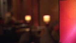 Lamps cast a cozy glow in a hotel lobby. Stock Footage