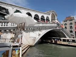 PASSENGER FERRY ON GRAND CANAL AT RIALTO BRIDGE Stock Footage