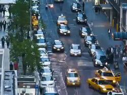 Long vertical pan on 51th street, filled with cars Stock Footage