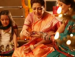 Family preparing rangoli in diwali festival Stock Footage