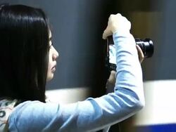 Camera girl waiting for a train Stock Footage