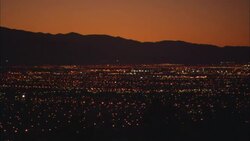 The lights of Las Vegas twinkle under an orange sky. Stock Footage