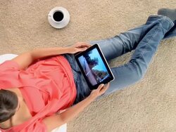 CU ZO Woman flicking through images on digital tablet / London, London, United Kingdom Stock Footage