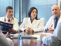 Doctors Review and Discuss Radiology Slides Stock Footage