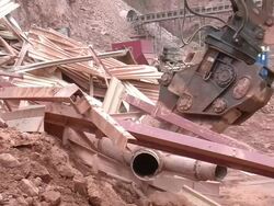 MS Demolition of crushing machine at quarry by bulldozer / Taben-Rodt, Rhineland-Palatinate, Germany Stock Footage