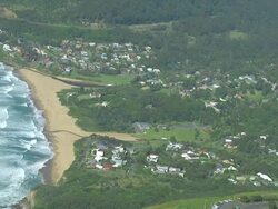 WS AERIAL ZI View of paragliding over seashore / Stanwell Park, Sydney New South Wales, Australia Stock Footage